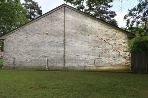 This part of the home's foundation is experiencing settlement (collapse). Eventually the brick veneer begins to separate from door and window frames. Finally framing and roof problems occur as well as plumbing problems. Foundation problems don't get bette